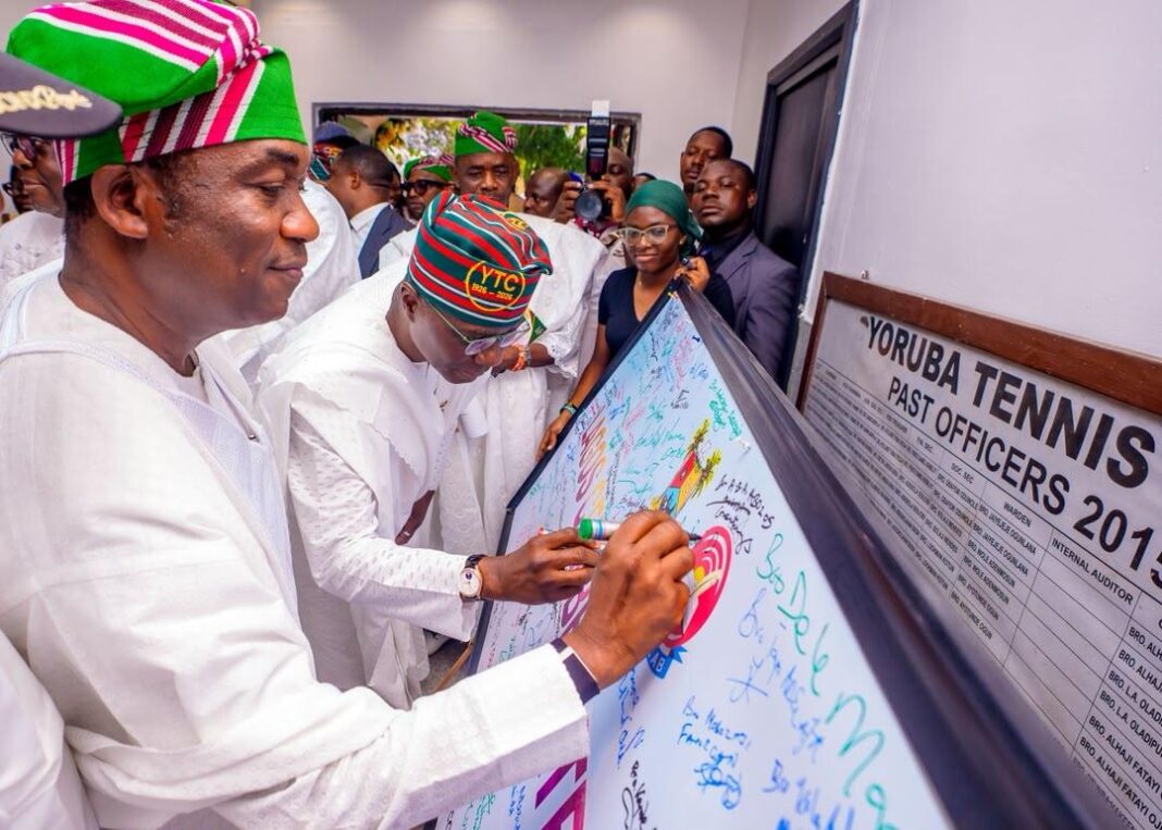 Governor of Lagos State, Mr. Babajide Sanwo-Olu (right) and his Deputy and APC Governorship Candidate, Dr. Obafemi Hamzat (left), sign the commemorative board during the Yoruba Tennis Club Centenary Anniversary Lecture in Onikan, Lagos, on Tuesday, September 15, 2026.