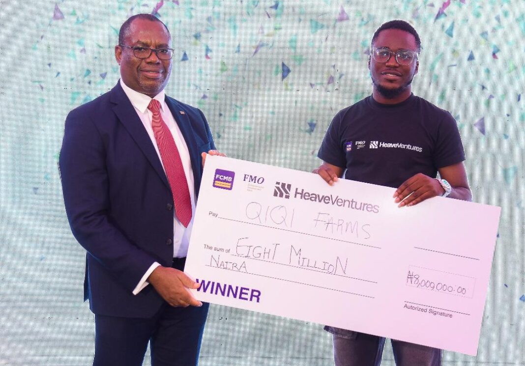 From left: Divisional Head, Agribusiness and Non-Oil Exports, First City Monument Bank (FCMB), Mr. Kudzai Gumunyu, presenting a cheque to Favour Adeleke of Qiqi Farms, the grand prize winner of the Agritech Hackathon 2025 organised by FCMB in partnership with the Dutch Entrepreneurial Development Bank (FMO) and HeaveVentures. The event took place in Lagos recently.