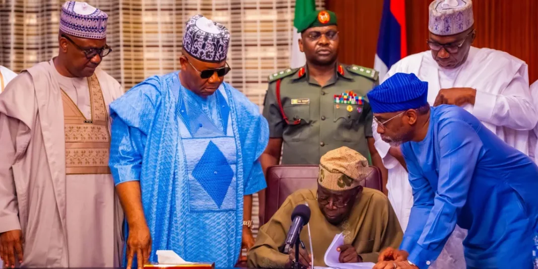 President Tinubu signing the nw tax bill into law2