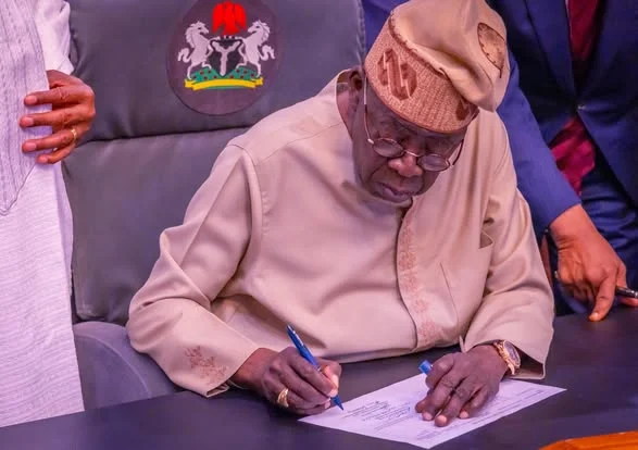 President Tinubu signing the electoral bill into law