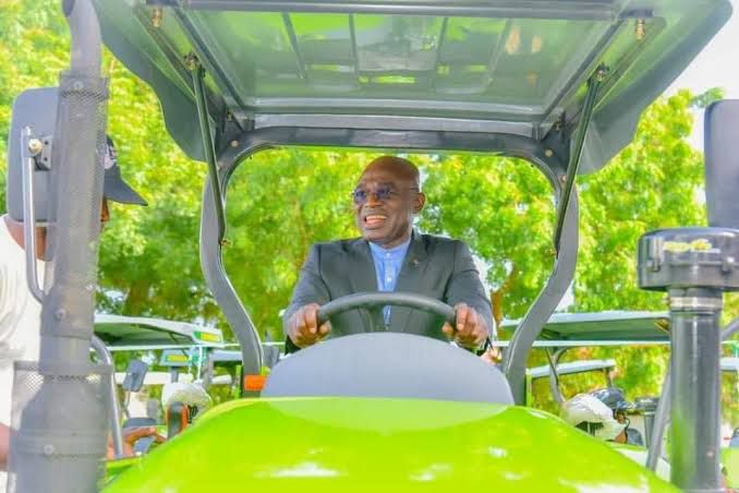 Governor Alia driving a tractor