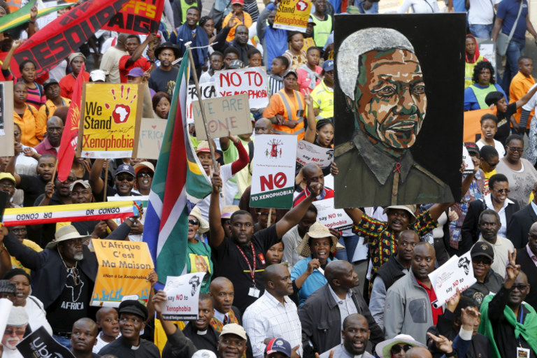 Demonstrators carry placards during a march against xenophobia in downtown Johannesburg, South Africa, on April 23, 2015. Mike Hutchings/Reuters