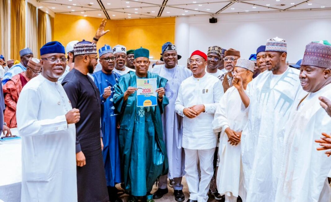 VP Shettima holding President Tinubu's nomination form , while APC Chairman, Professor Yilwatda, and others look on in admiration