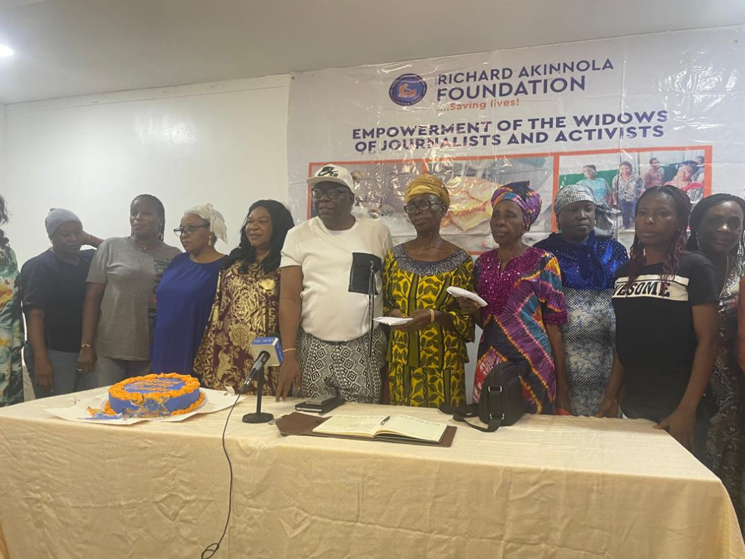 Mr Richard Akinnola and the women beneficiaries