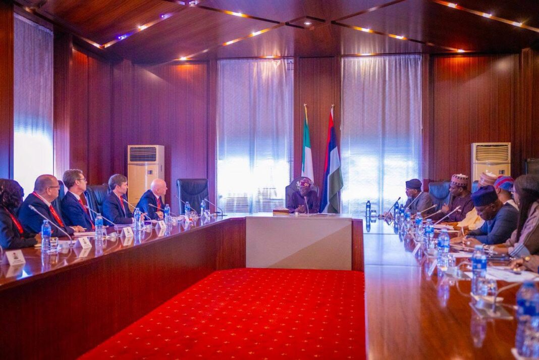 President Bola Tinubu, government officials, Mastercard Chief Executive, Michael Miebach, and his team