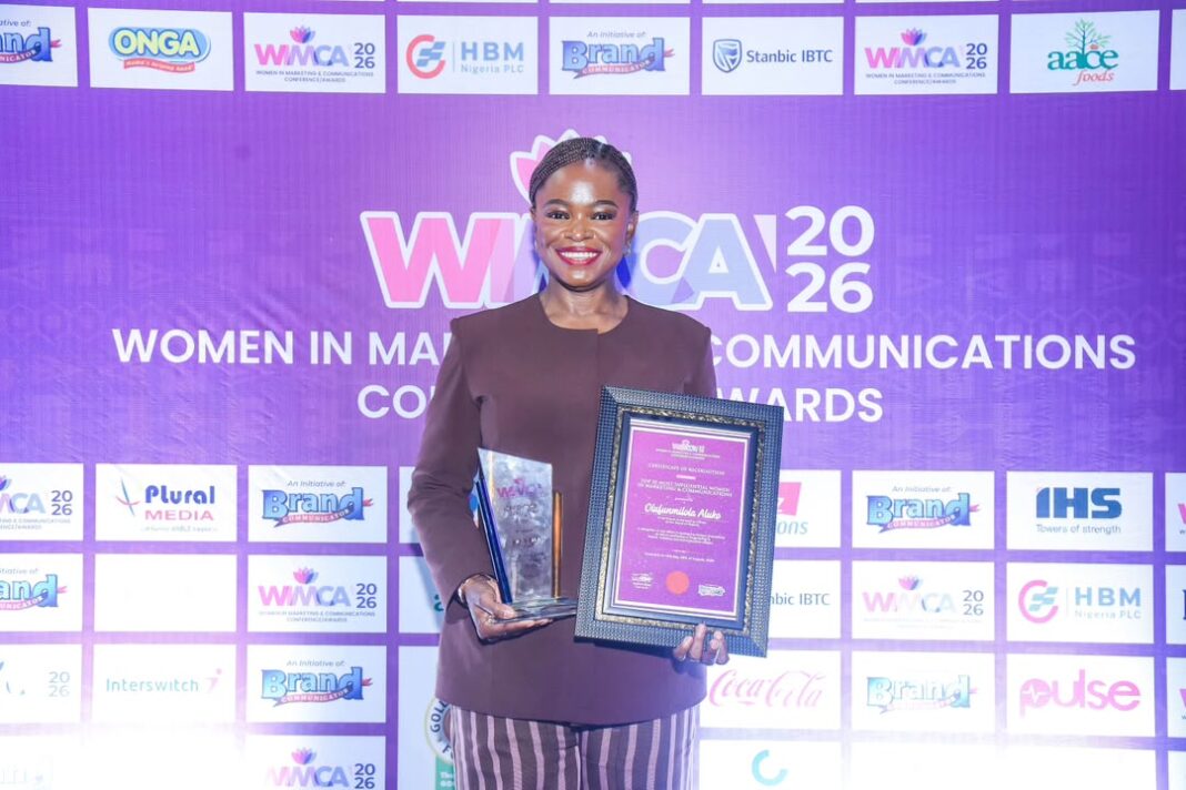 Olufunmilola Aluko holding the award plaques