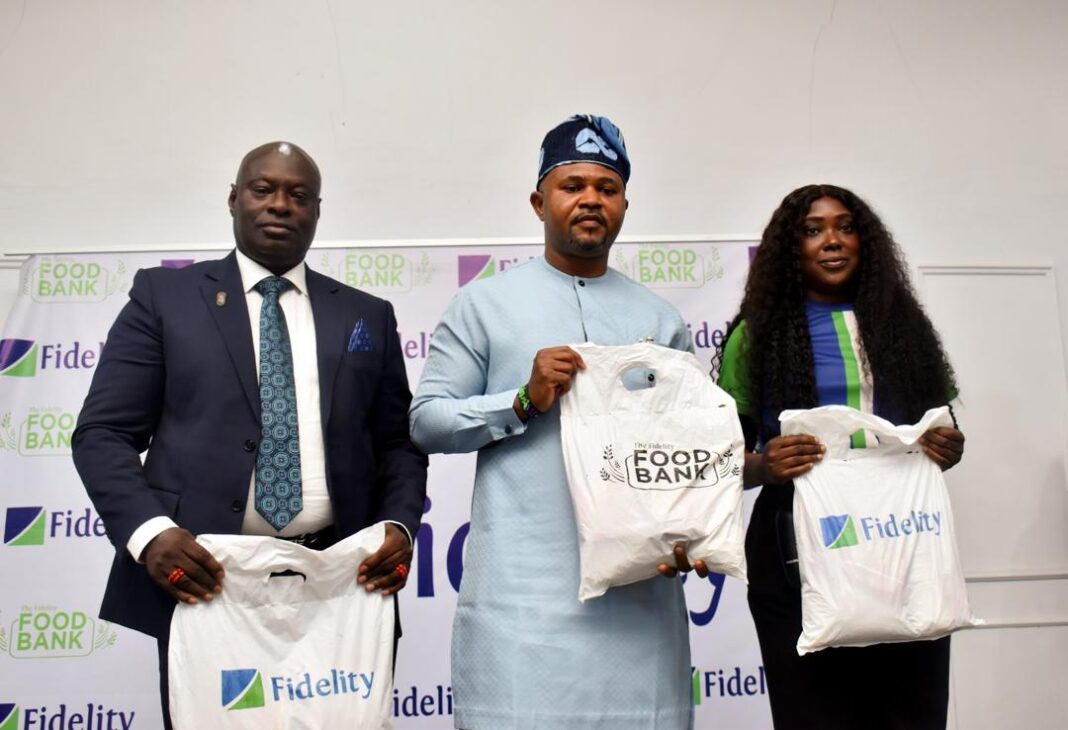L-R: Branch Leader, Fidelity Bank Plc, Uromi, Joseph Ero; Commissioner for Agriculture and Food Security, Edo State, Jerry Uwangue; and Team Lead, CSR, Fidelity Bank Plc, Victoria Abuka; at the Fidelity Food Bank distribution event held at Udomi, Irrua, in Esan Central Local Government Area, Edo State recently